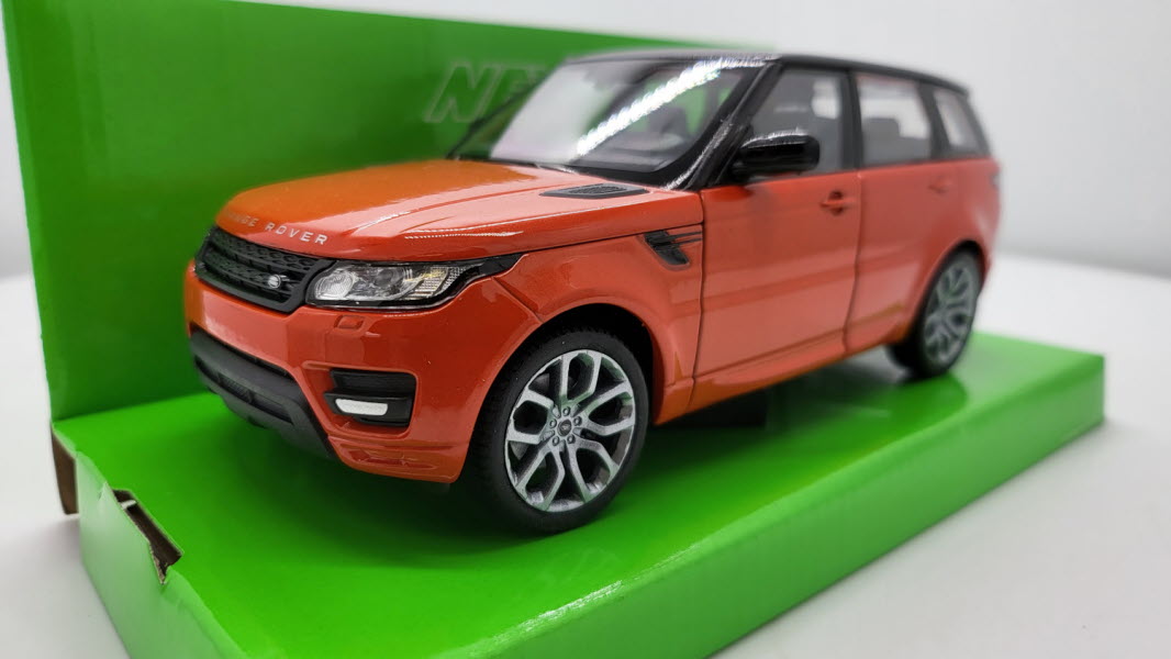 Welly: Land Rover Range Rover Sport Donkeroranje/Zwart - Schaal 1:24
