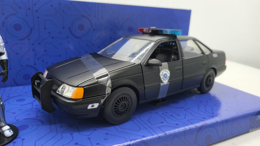 Ford Taurus Detroit Police RoboCop Zwart - Jada Toys 1:24