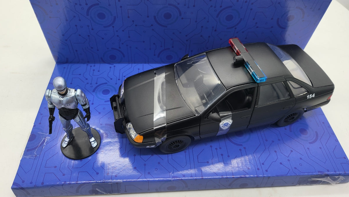 Ford Taurus Detroit Police RoboCop Zwart - Jada Toys 1:24