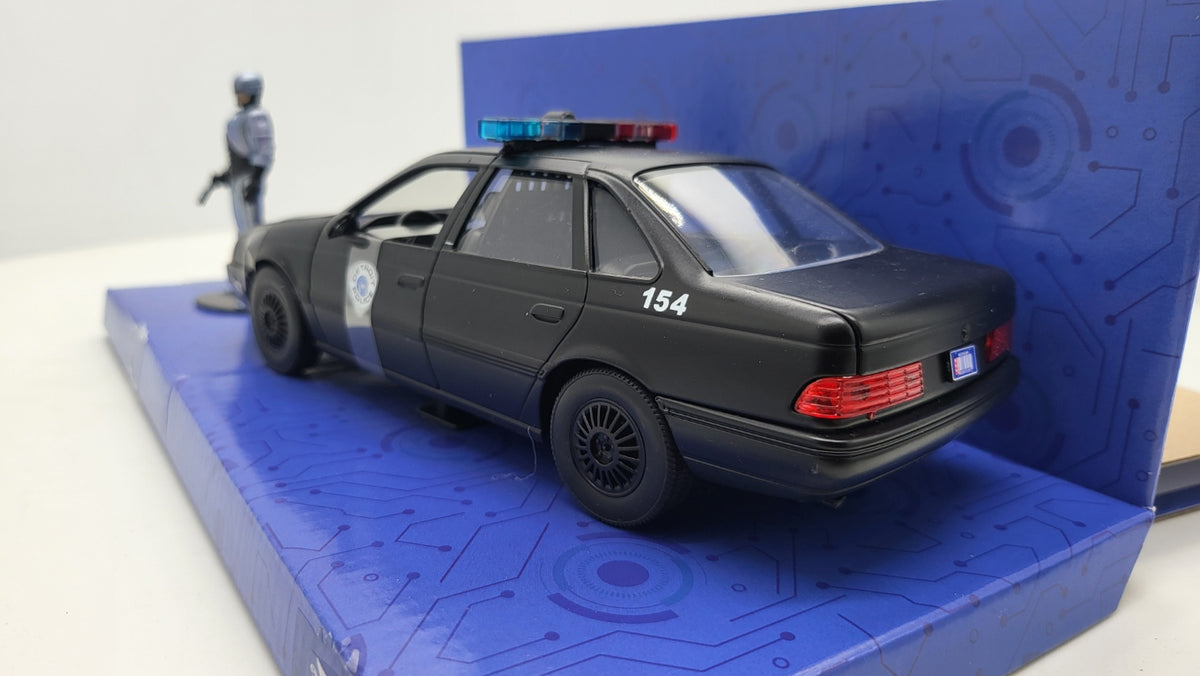 Ford Taurus Detroit Police RoboCop Zwart - Jada Toys 1:24