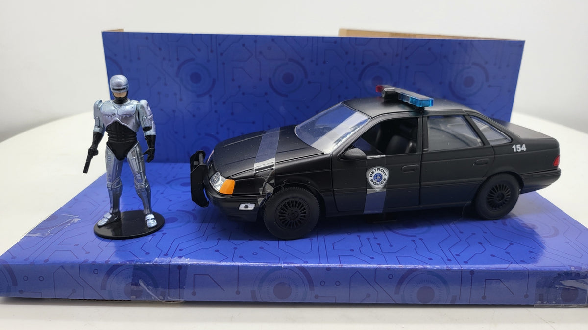 Ford Taurus Detroit Police RoboCop Zwart - Jada Toys 1:24