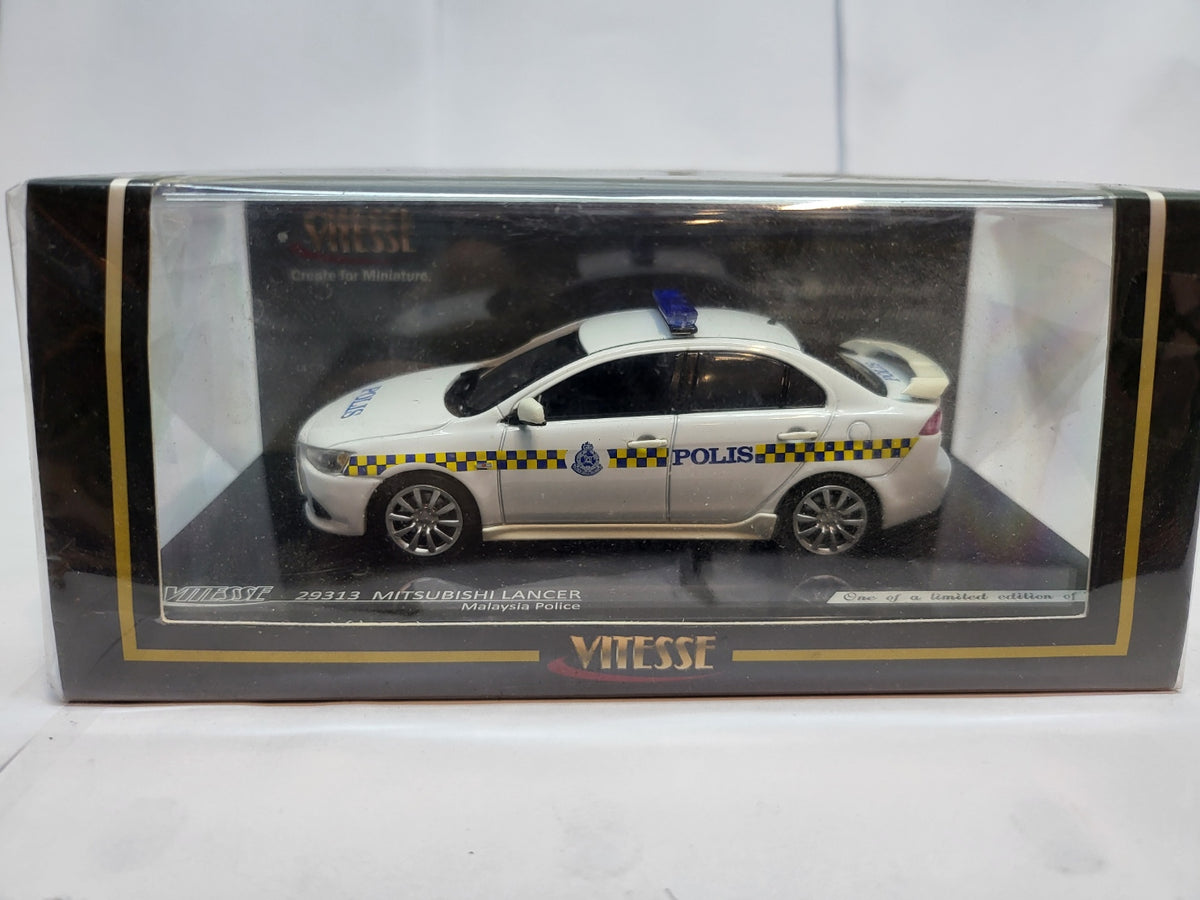 Vitesse Mitsubishi Lancer Maleisië Politie Wit  - Schaal 1:43