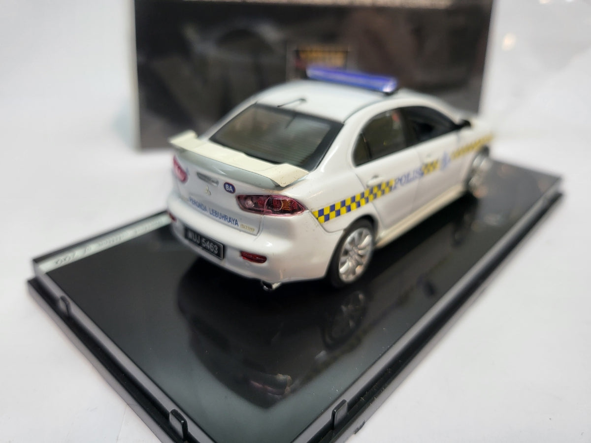 Vitesse Mitsubishi Lancer Maleisië Politie Wit  - Schaal 1:43