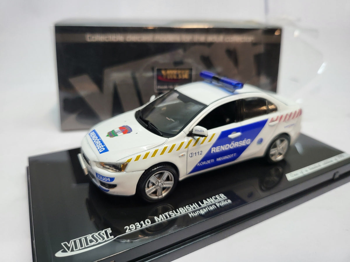 Vitesse Mitsubishi Lancer Hongarije Politie Wit/Blauw - Schaal 1:43