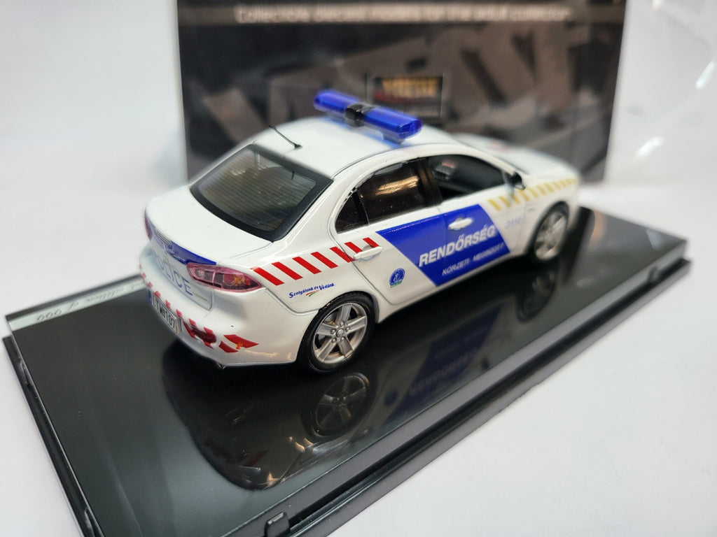 Vitesse Mitsubishi Lancer Hongarije Politie Wit/Blauw - Schaal 1:43
