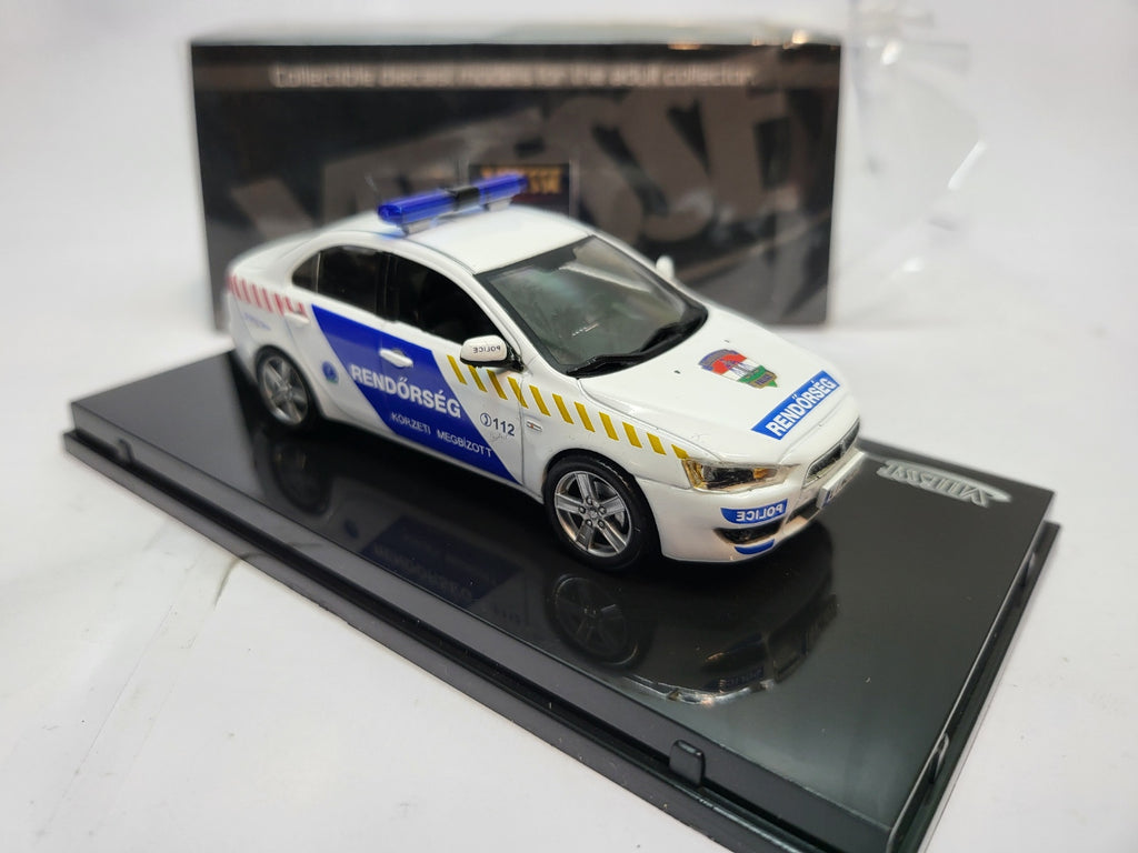 Vitesse Mitsubishi Lancer Hongarije Politie Wit/Blauw - Schaal 1:43