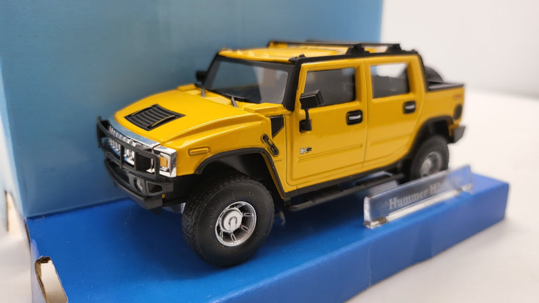 Cararama: Hummer H2 SUT Geel - Schaal 1:43