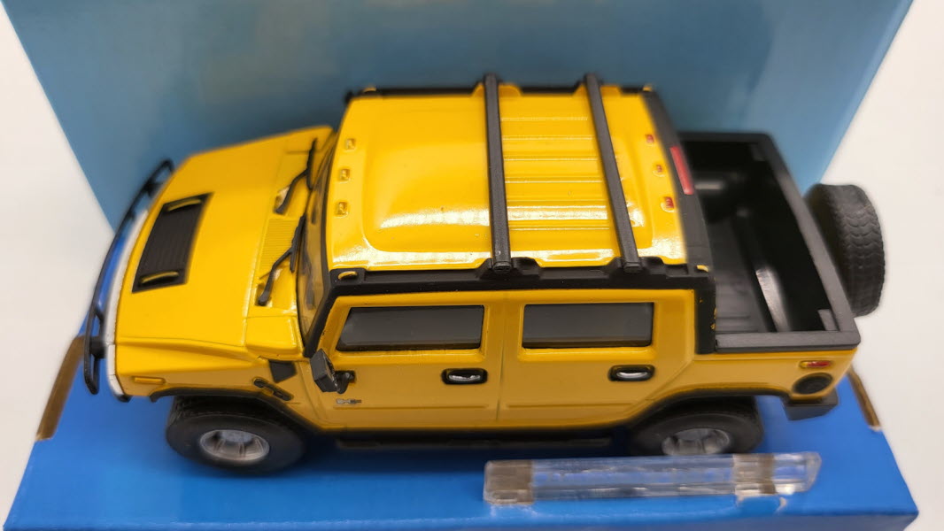 Cararama: Hummer H2 SUT Geel - Schaal 1:43
