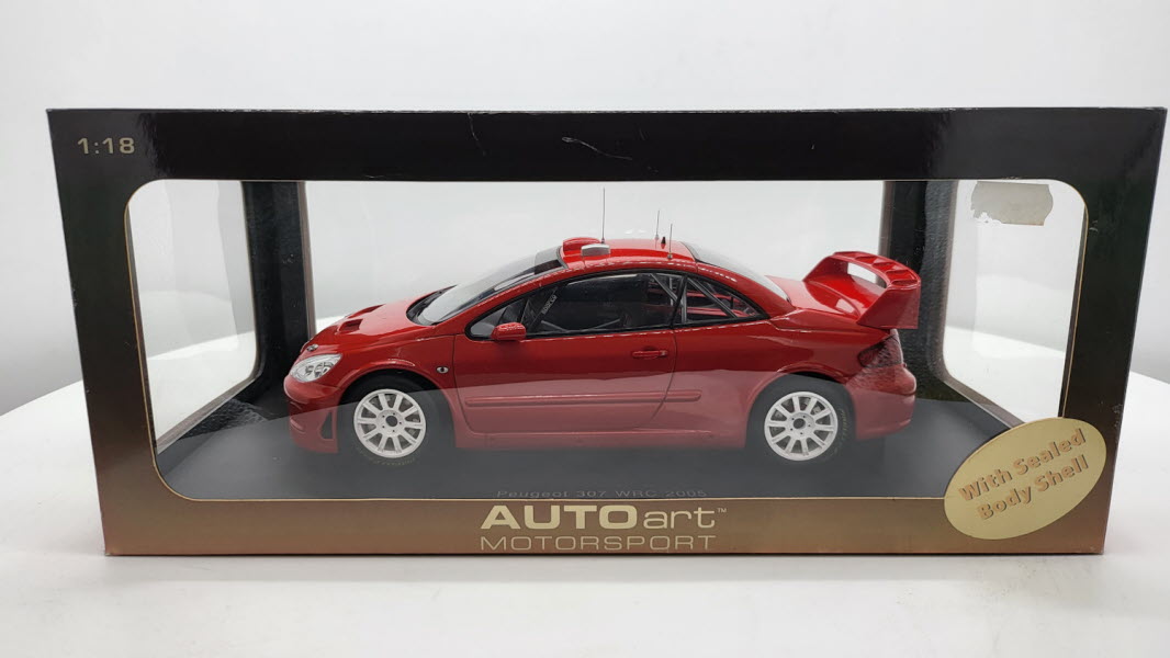 AutoArt: Peugeot 307 WRC Plain Body Version Rood (2005) - Schaal 1:18