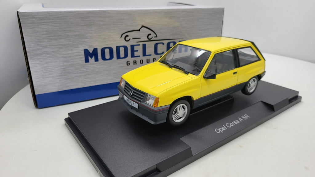 MCG: Opel Corsa A SR Geel (1982) - Schaal 1:18