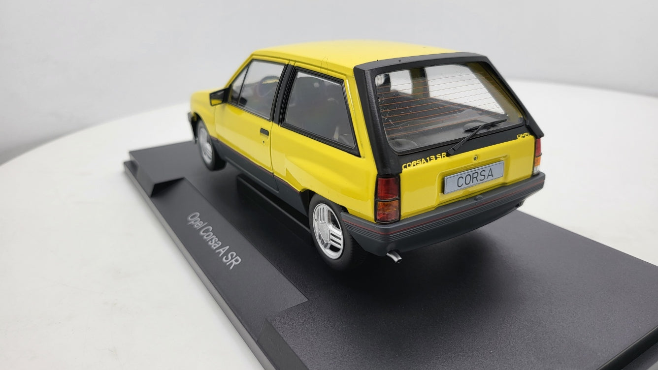 MCG: Opel Corsa A SR Geel (1982) - Schaal 1:18
