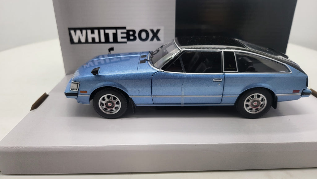 WhiteBox Toyota Celica XX, lichtblauw/zwart, 1978 - Schaal 1:24