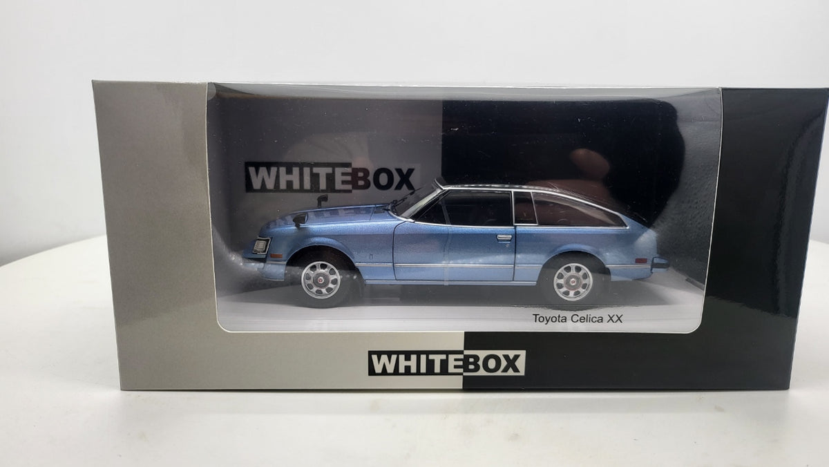 WhiteBox Toyota Celica XX, lichtblauw/zwart, 1978 - Schaal 1:24
