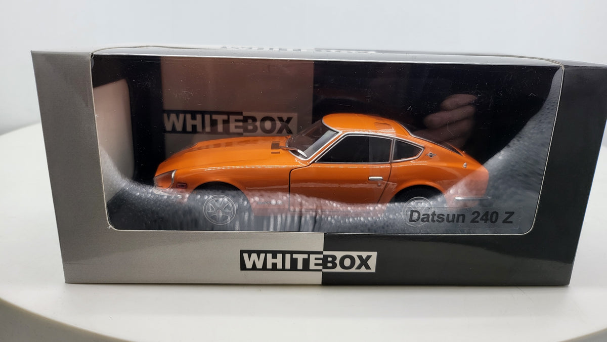 Datsun 240 Z Oranje 1969 - WhiteBox 1:24