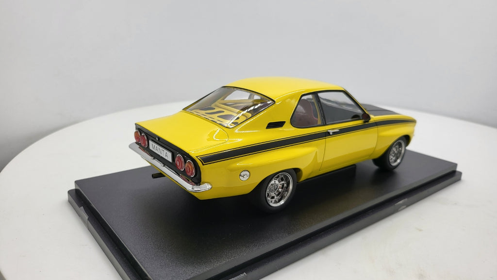 MCG: Opel Manta A Irmscher Geel/Zwart (1974) - Schaal 1:18