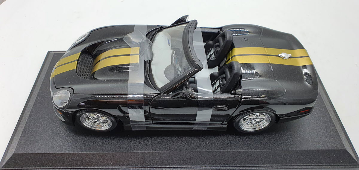 Maisto: Shelby Series 1 Zwart/Goud - Schaal 1:18