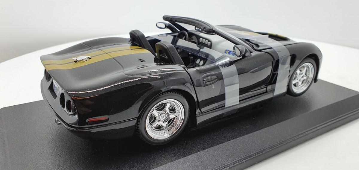 Maisto: Shelby Series 1 Zwart/Goud - Schaal 1:18