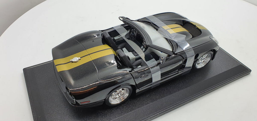 Maisto: Shelby Series 1 Zwart/Goud - Schaal 1:18