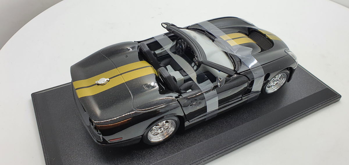 Maisto: Shelby Series 1 Zwart/Goud - Schaal 1:18