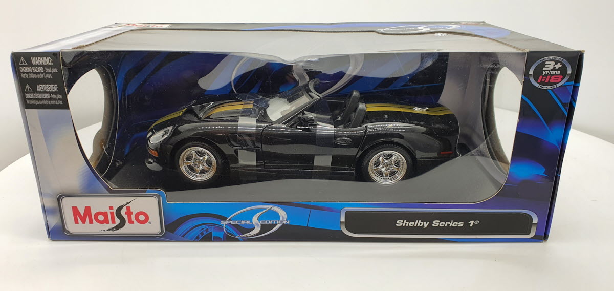 Maisto: Shelby Series 1 Zwart/Goud - Schaal 1:18
