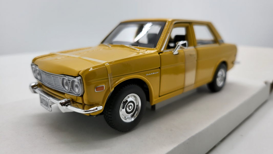 Maisto Datsun 510 Geel 1971 - Schaal 1:24
